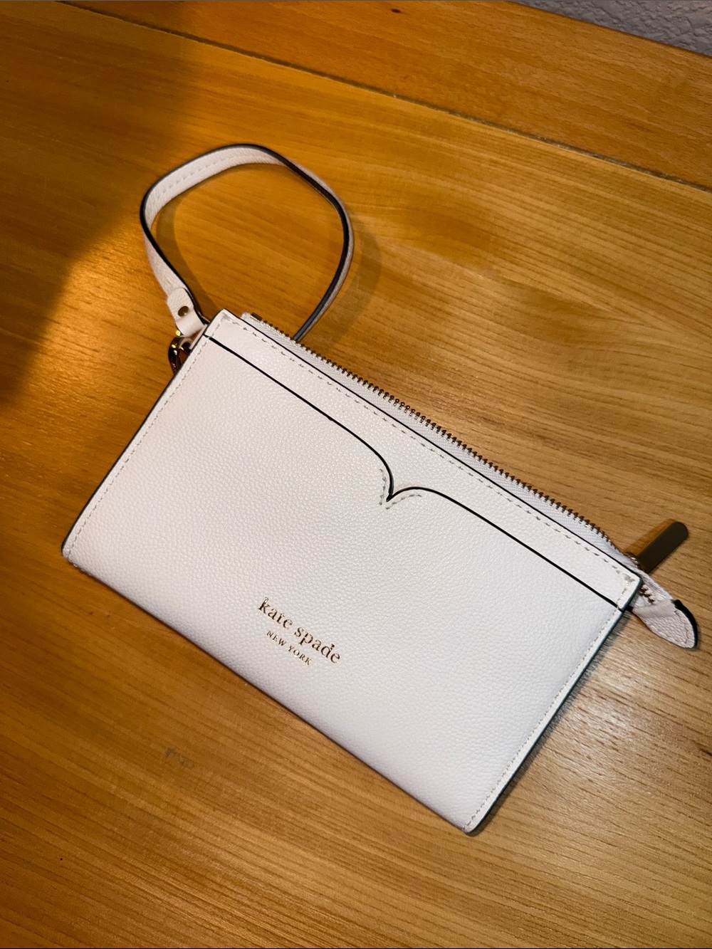 kate spade white pebbled leather wristlet wallet with gold logo